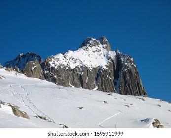 Andermatt Ski Slopes With Blue Sky, Switzerland