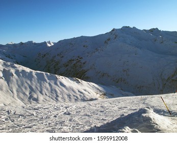 Andermatt Ski Slopes With Blue Sky, Switzerland