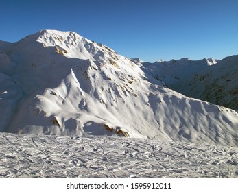 Andermatt Ski Slopes With Blue Sky, Switzerland