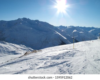 Andermatt Ski Slopes With Blue Sky, Switzerland