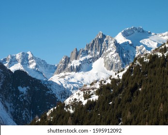 Andermatt Ski Slopes With Blue Sky, Switzerland