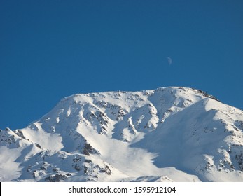 Andermatt Ski Slopes With Blue Sky, Switzerland