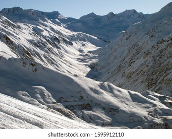 Andermatt Ski Slopes With Blue Sky, Switzerland