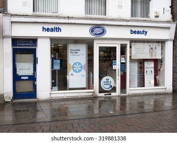 Andover, High Street, Hampshire, England - September 21, 2015: Boots The Chemist Store, Late Rain Soaked Afternoon