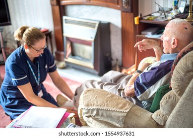 ANDOVER,HAMPSHIRE/UNITED KINGDOM-NOVEMBER 6 2019:A District Nurse Visits A Nineny Four Year Old Patient At His Home To Treat For Pulmonary Odema And Head/brain Injuy.