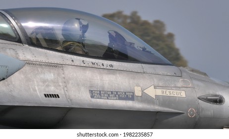 Andravida Greece APRIL, 03, 2019 Military Pilot With Helmet In The Cockpit Of A NATO Grey Fighter Jet. Lockheed Martin F-16 C Fighting Falcon Or Viper Of United States Air Force In Europe USAFE