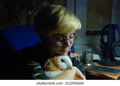 Androgynous Person Hugging An Owl Plush