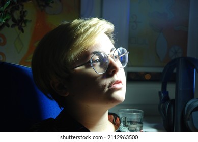 Androgynous Person Looking At The Light Source