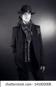 Androgynous. Portrait Of Young Woman In Man's Suit.