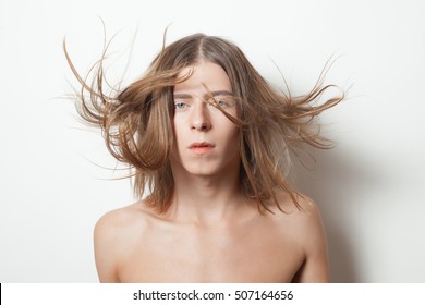 Androgyny Young Man With Hair On The Wind