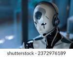 Android AI robot wearing a headset and working in the office: artificial intelligence, business and automation concept