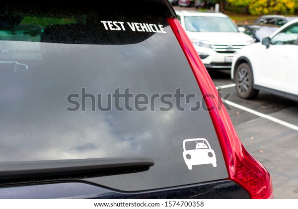 Android robot logo and \'test\
vehicle\' text on car rear window - Palo Alto, California, USA -\
2019