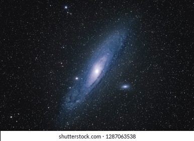 Andromeda Galaxy M31 with Nebula, Open Cluster, Globular Cluster, stars and space dust in the universe long expose - Powered by Shutterstock