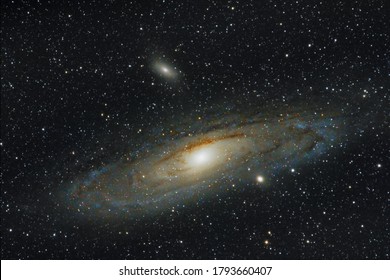 Andromeda galaxy with sattelite, shot at 840mm with equatorial mount - Powered by Shutterstock