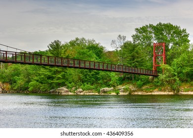 The Androscoggin Swinging Bridge is a pedestrian suspension bridge spanning the Androscoggin River between the Topsham Heights neighborhood of Topsham, Maine and neighboring Brunswick.