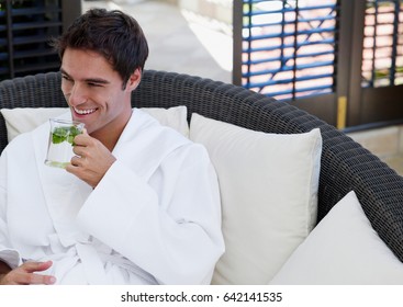 Andsome Man Drinking Tea And Relaxing In Spa