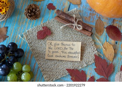 Andwritten Text Note To Give Thanks To The LORD On Vintage Wooden Autumn Background With Grapes, Pumpkin, And Dry Leaves. Christian Thanksgiving, Gratitude, And Praise To God. Top Table View.