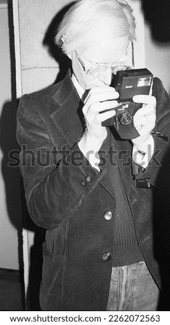 Andy Warhol famous painter artist photographer at a reception in 1975 New York City
