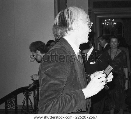 Andy Warhol famous painter artist photographer at a reception in 1975 New York City