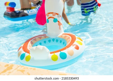 Anenii Noi,Moldova-07.01.2022:llama Inflatable Ring Swimming Balloon Floats On Water Pool.lot Of Childrens Are Playing In The Background,enjoy The Summer Time,heat Warm Weather.cute Llama Shape