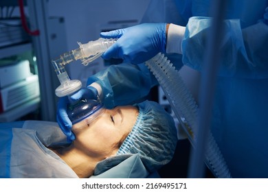Anesthesia mask placed on the face of female patient