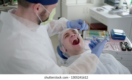 Anesthetist Doctor Is Doing Anesthesia Injection Before Orthodontics Surgery In The Dental Hospital Office