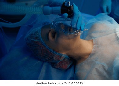 Anesthetist preparing female patient for medical operation - Powered by Shutterstock