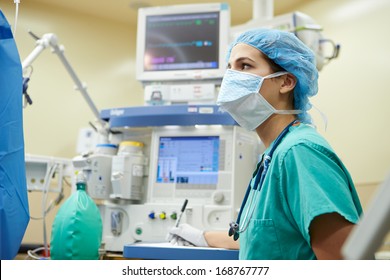 Anesthetist Working In Operating Theatre