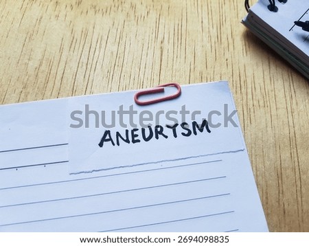 Aneurysm writting on table background.