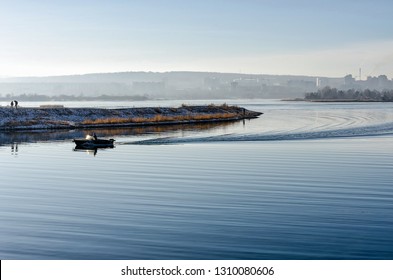 Angara River embankment in Irkutsk, misty weather. In sunny day with boat and ripple - Powered by Shutterstock