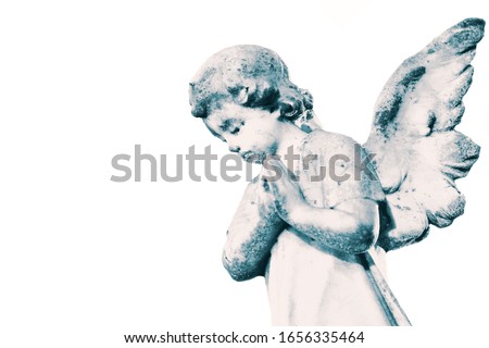Angel cherub stone statue memorial grave headstone isolated on a white background.  With colour toning