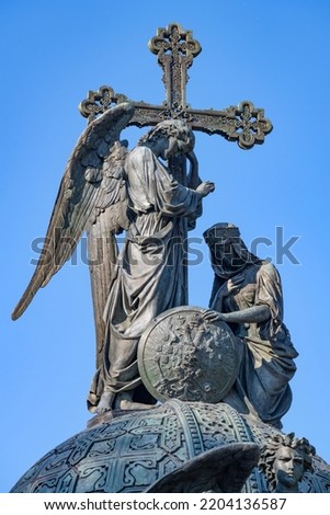 Angel with a cross - the top of the Millennium of Russia monument (1862) close-up. Kremlin of Veliky Novgorod, Russia
