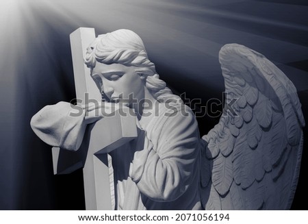 Angel of death. Black and white image of ancient statue.