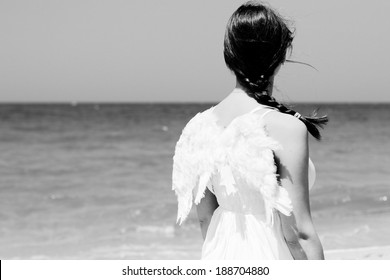 Angel Ethnic Woman Near The Sea