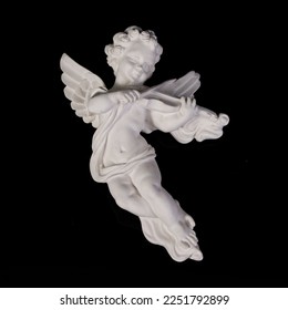 Angel figurine isolated on black background. Cupid with bow and arrow. Antique porcelain cupid figurine close-up - Shutterstock ID 2251792899
