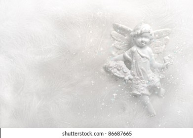 Angel On White Feather Background With Sparkles