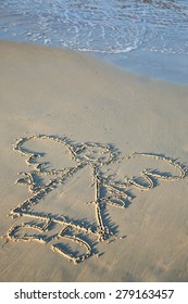 Angel Painted In The Sand Of A Beach