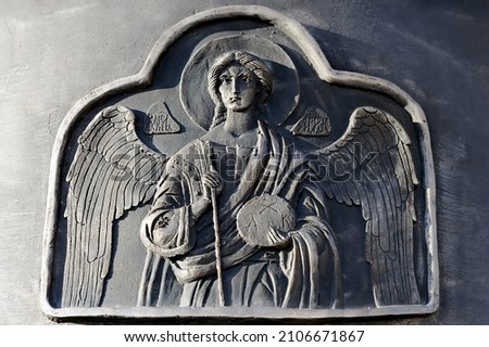 Angel relief on the metal surface