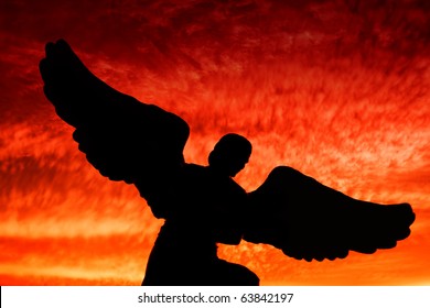 An Angel Silhouette During Dramatic Sunset