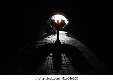 Angel Silhouette With Shadow In The Tunnel.