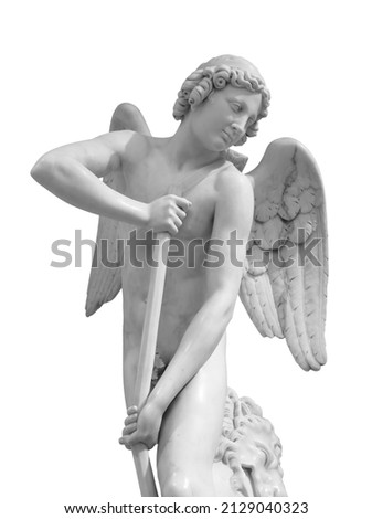 Angel statue isolated on white background with clipping path. White stone sculpture of praying cherub