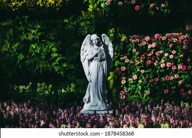 Angel Statue In The Public Park English Flowers Garden Park Style.