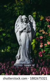 Angel Statue In The Public Park English Flowers Garden Park Style.