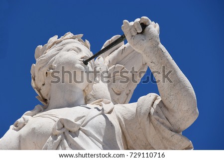 Angel with trumpet at Commerce Square in Lisbon