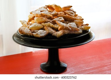 Angel Wings, Funnel Cakes, On Black Cake Stand , Red Background