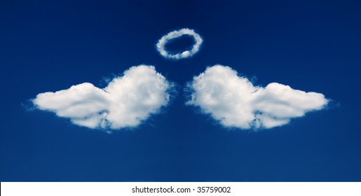 Angel wings and nimbus formed from beautiful fluffy clouds