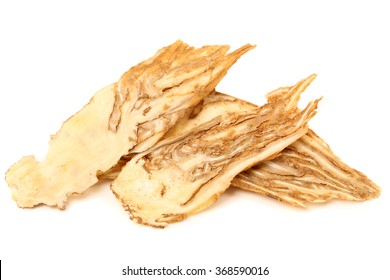 Angelica root used in chinese traditional herbal medicine, over white background. Radix angelicae sinensis, Dang gui.
