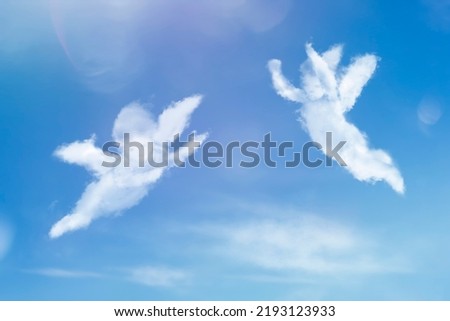 Angels flying in the sky. Cloud figures of angels