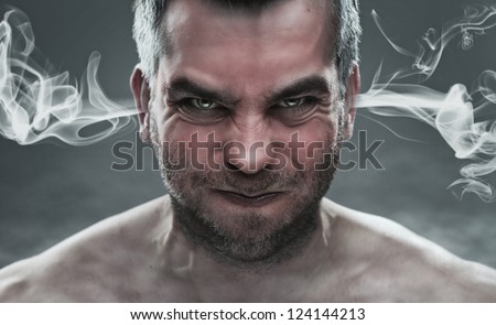 Anger, close up of angry man with smoke coming out from his ears
