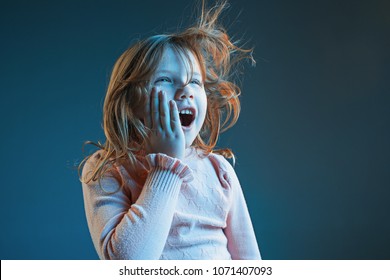 The Anger And Surprised Teen Girl. Hate, Rage. Crying Emotional Angry Teenager In Colorful Bright Lights At Studio Background. Emotional Face. Sport Fan Human Emotions, Facial Expression Concept.